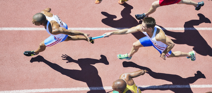 Relay Race Baton Handoff on Track